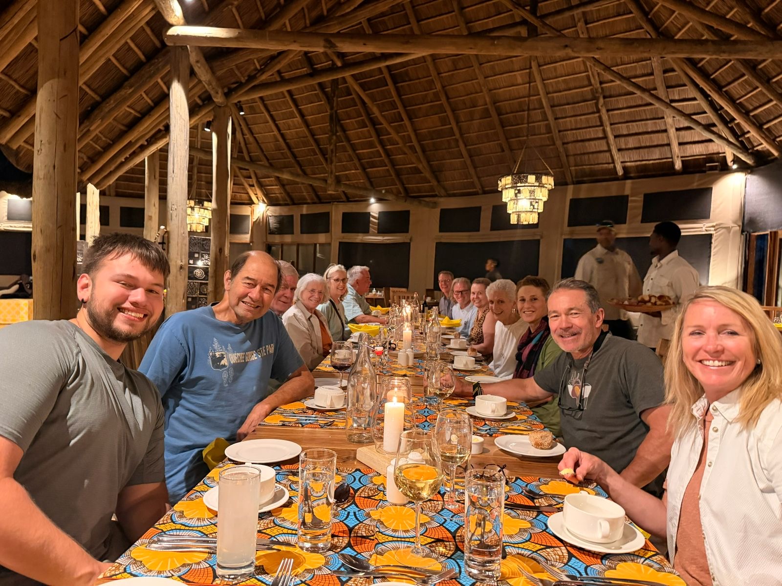 Guests enjoying a candlelit dinner at a safari lodge