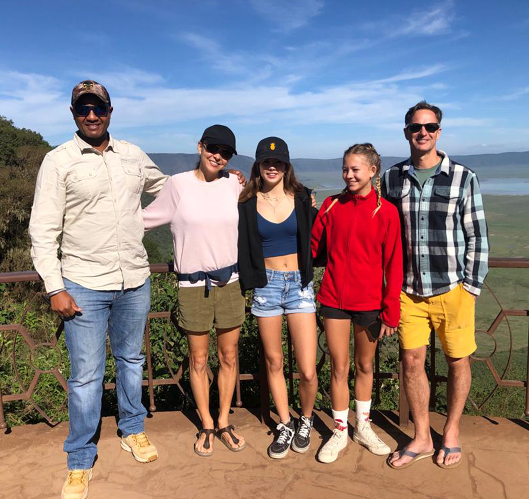 John kiboko Safaris with clients at Ngorongoro Crater Tour